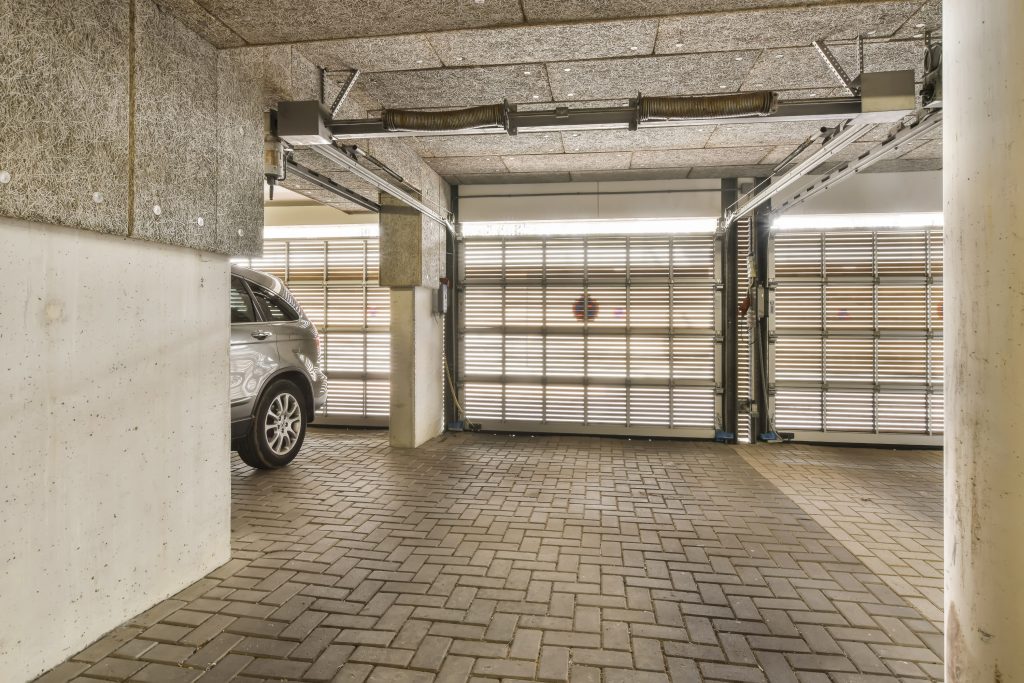 a parking garage with a car parked in it